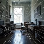 A cramped, digitally distorted office room with chaotic pixelated lines and blurred boundaries, evoking the overwhelm of constant virtual meetings.